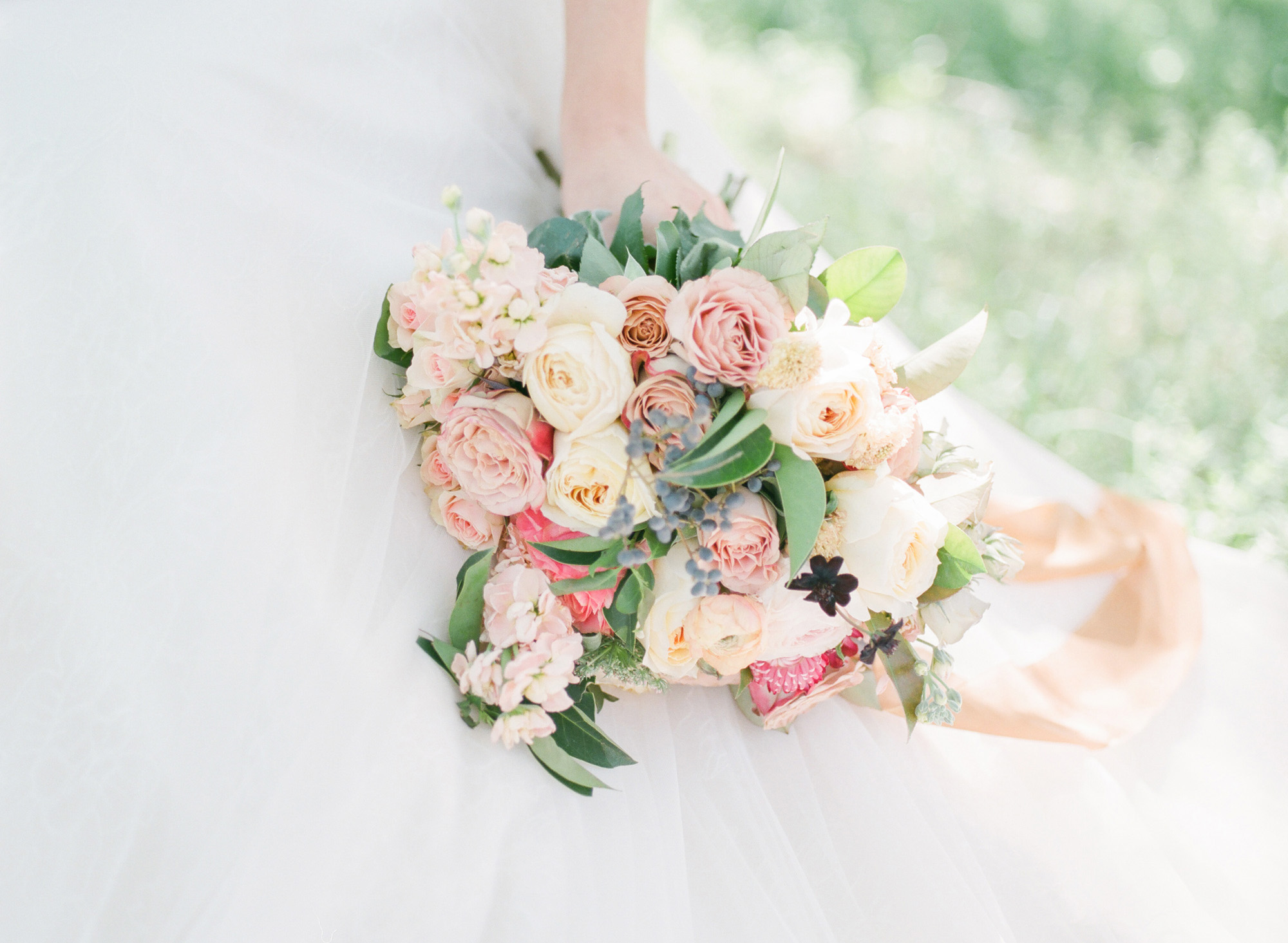 Bouquet with pastel garden roses for a Dallas wedding, adorned with silk ribbon.