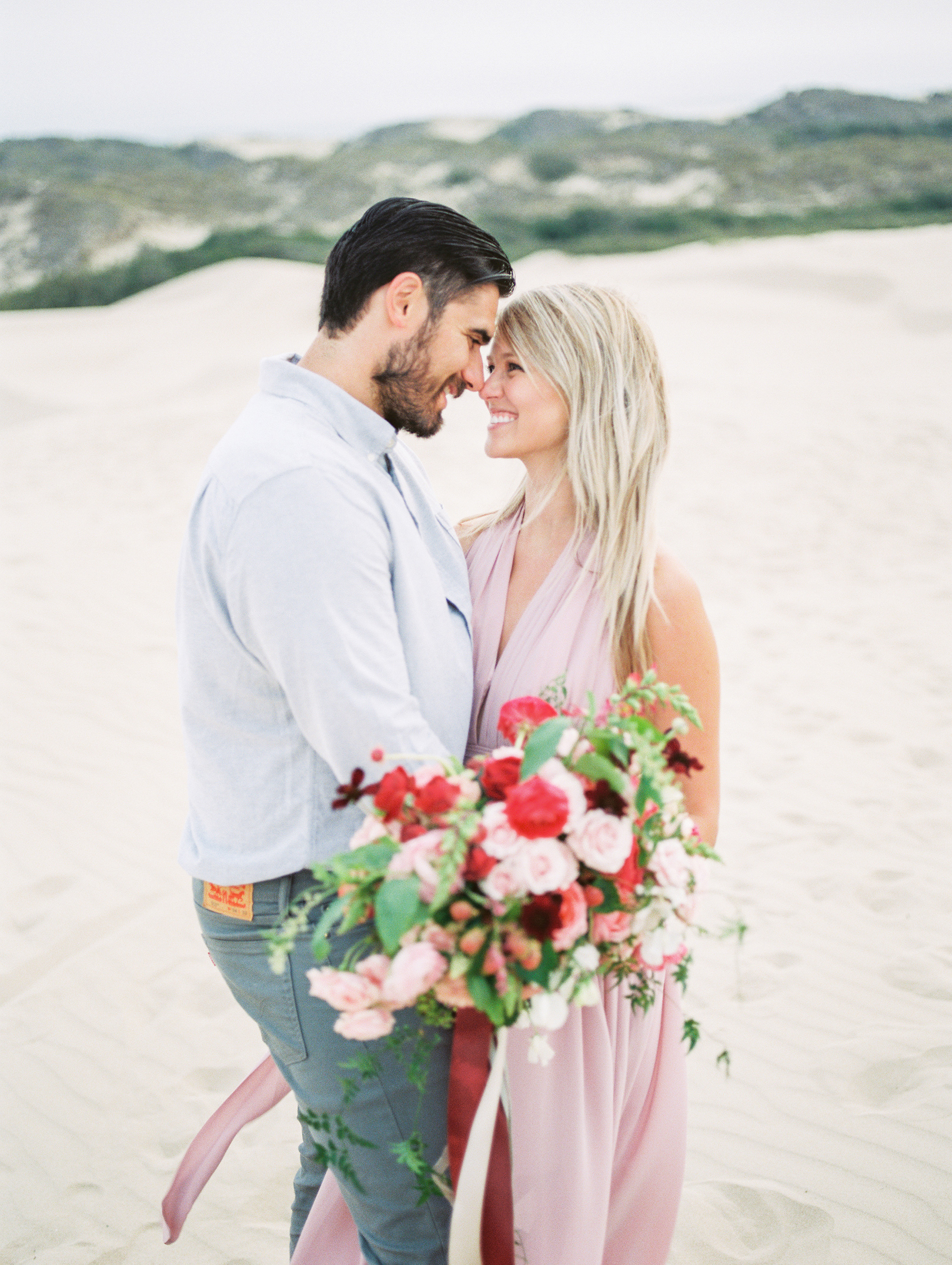 Santa Barbara wedding photographer Tenth & Grace captures Chelsea and Nico on the sand dunes.