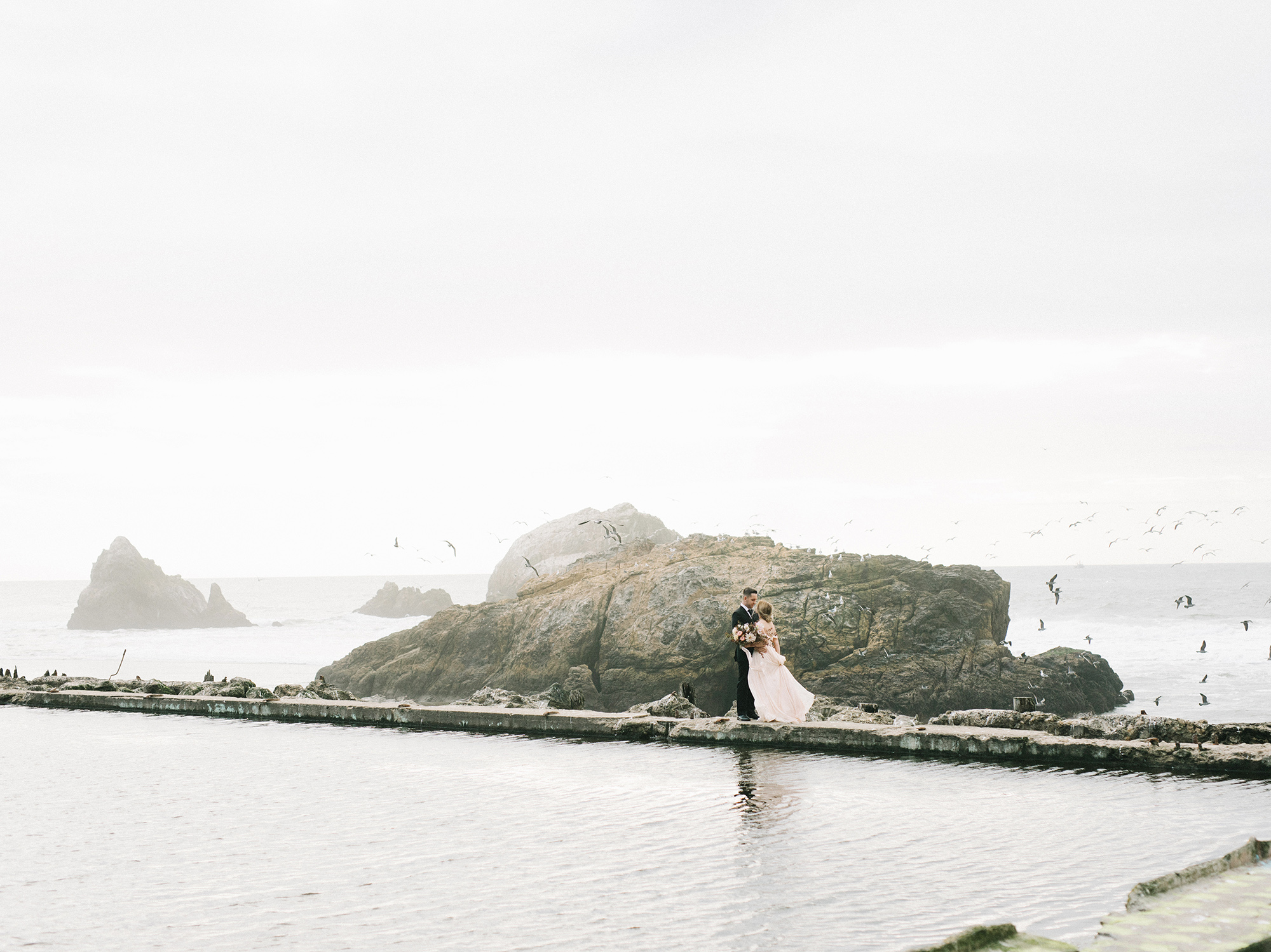 Dramatic views at the Sutro Baths, photographed by San Francisco film wedding photographer Tenth & Grace.