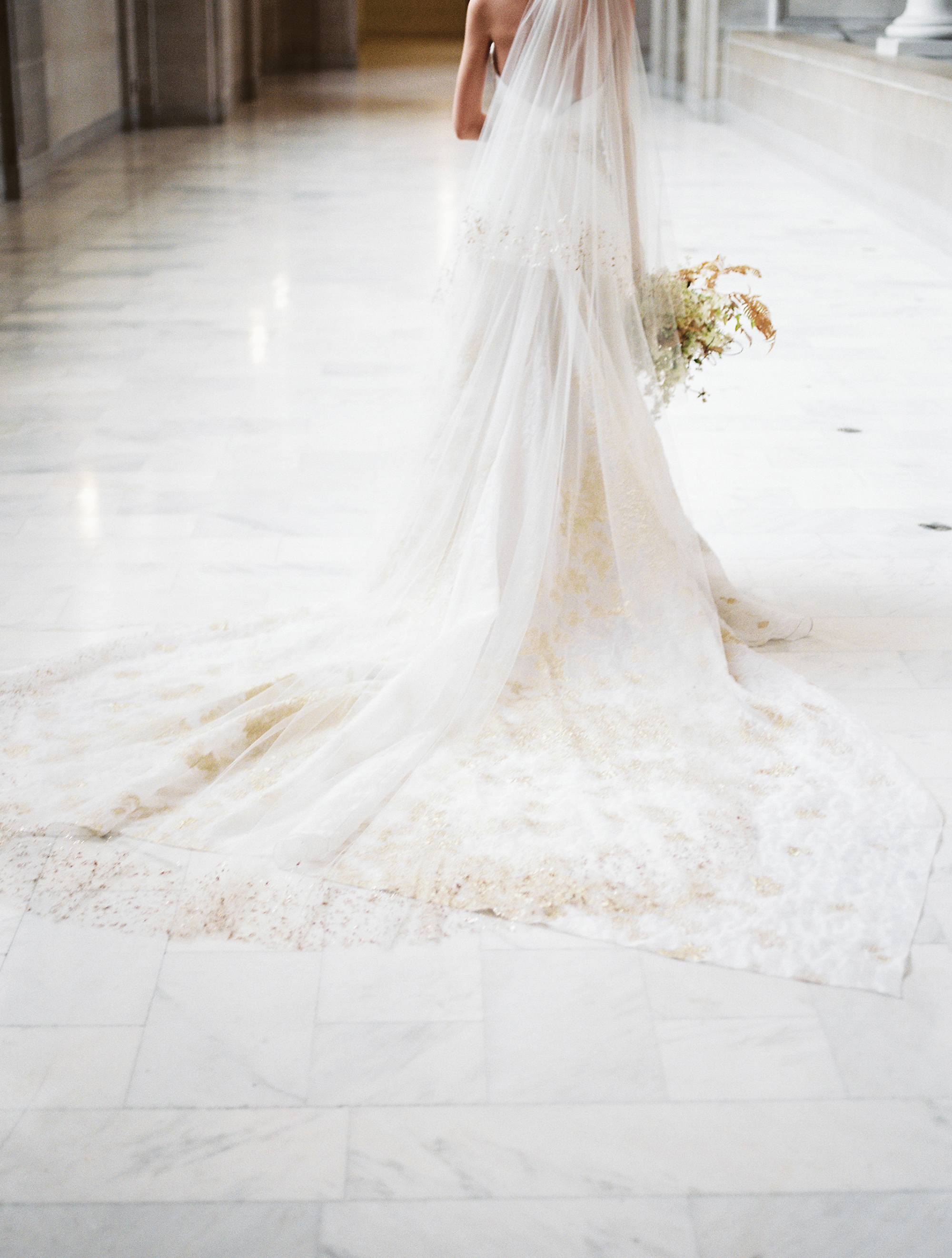 A cathedral train on this Carol Hannah wedding gown