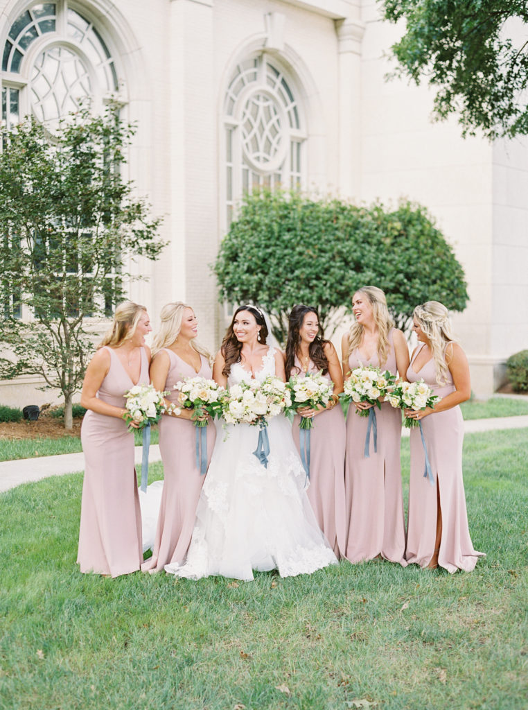 Bride and bridesmaids pose before their Swan House wedding.